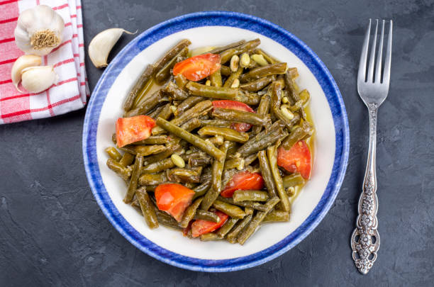 istock Fresh green cowpea salad with tomato and garlic. 1282981648