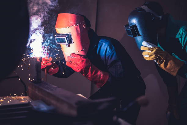 istock Metal welding steel works using electric arc welding machine 1282982514