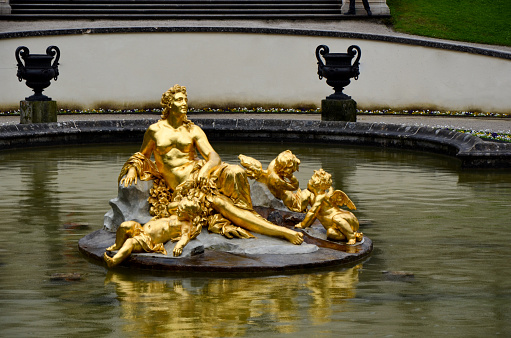 Ettal, Germany, May 11, 2013 - Golden fountain at the castle park Linderhof in Bavaria, Germany