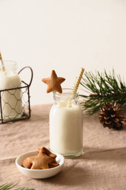 milk and homemade cookies on table. close up. - milk milk bottle drinking straw cookie imagens e fotografias de stock