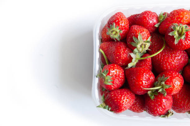 istock Box of strawberry on white background 1282983060
