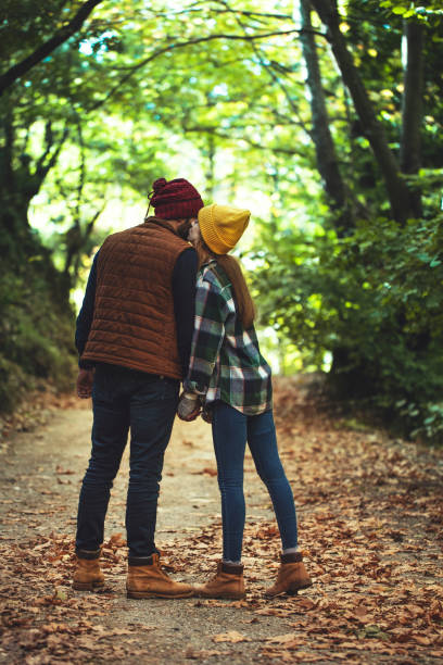 istock young lovers hiking in the forest 1282984175