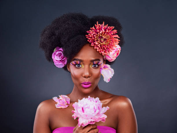 Studio shot of a beautiful young woman posing with flowers in her hair