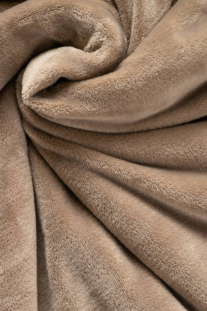 istock A warm blanket plush micro fleece fabric, swirled into a pattern background 1282984940