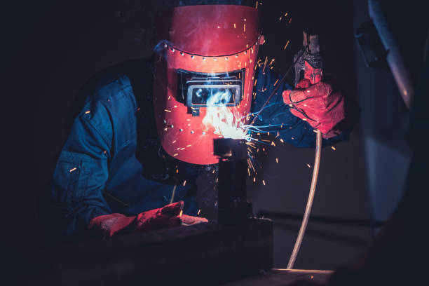 istock Metal welding steel works using electric arc welding machine 1282985224