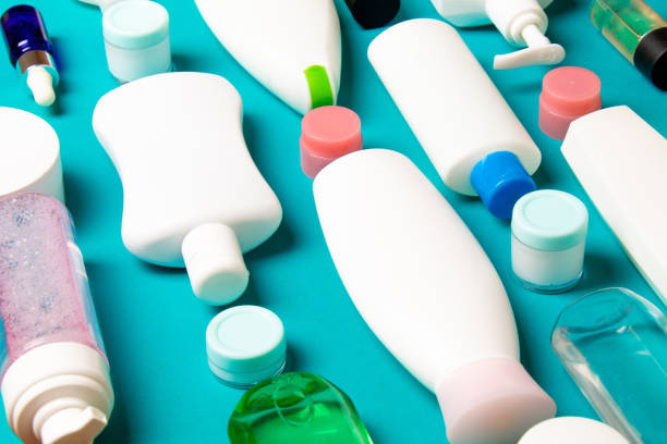 istock Group of plastic bodycare bottle Flat lay composition with cosmetic products on colored background empty space for you design. Set of White Cosmetic containers, top view with copy space 1282985596