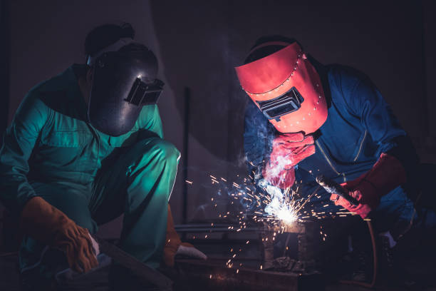 istock Metal welding steel works using electric arc welding machine 1282986756