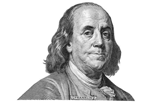 istock Benjamin Franklin cut from new 100 dollars banknote  on white background fragment. 1282988357
