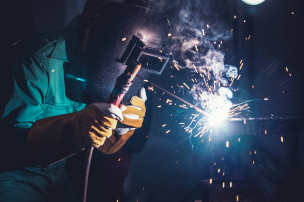 istock Metal welding steel works using electric arc welding machine 1282989006