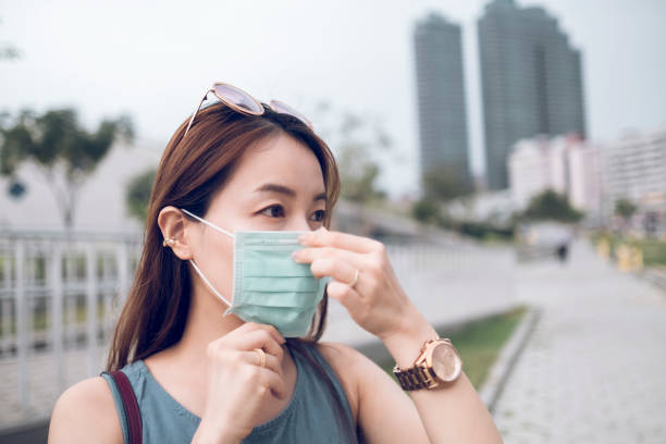istock Asian woman wearing a mask 1282990462