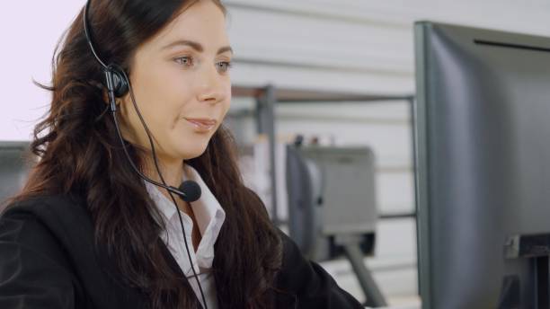 istock Business people wearing headset working in office 1282990508