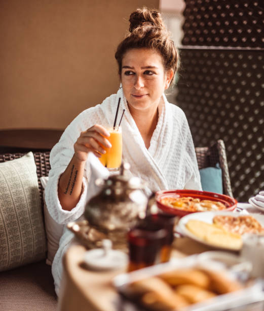istock woman at the table for the buffet breakfast with fruit 1282990983