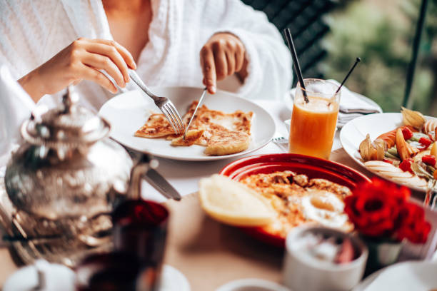 istock woman at the table for the buffet breakfast with fruit 1282990997