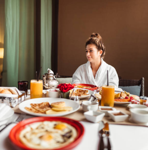 istock woman at the table for the buffet breakfast with fruit 1282991005