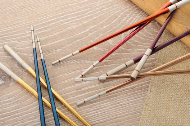 istock asian chopsticks on wooden brown background 1282991744