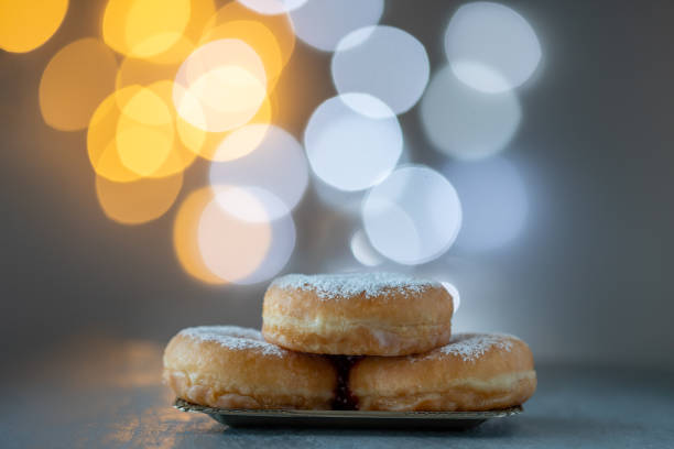 Hanukkah concept with sufganiyah and bright light in the background