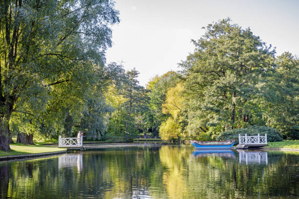 Tow ferry at a small lake in an idyllic park, the Frederiksberg Have in the middle of Copenhagen