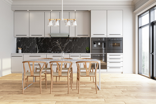 Modern Kitchen Interior With White Cabinets, Wooden Chairs And Parquet Floor