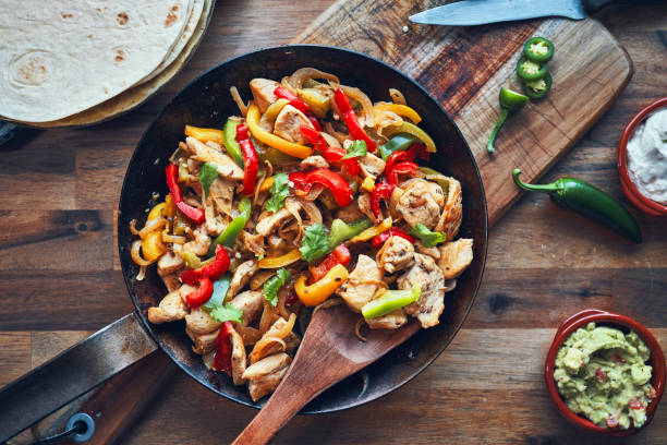 istock Fajitas de Pollo Chicken marinated Tortillas with Onions and Peppers 1282996526