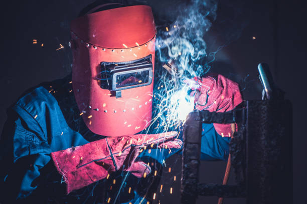 istock Metal welding steel works using electric arc welding machine 1282996719