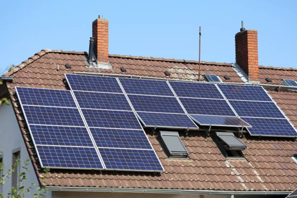 istock Solar panels on house roof 1282997464