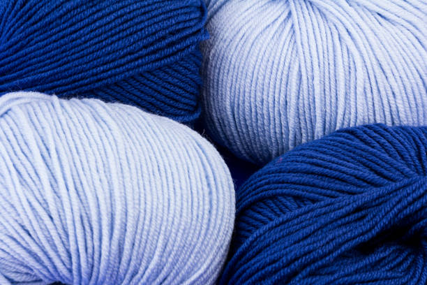 istock woolen merinos blue threads on blue background. natural wool. knitting. background 1282998842