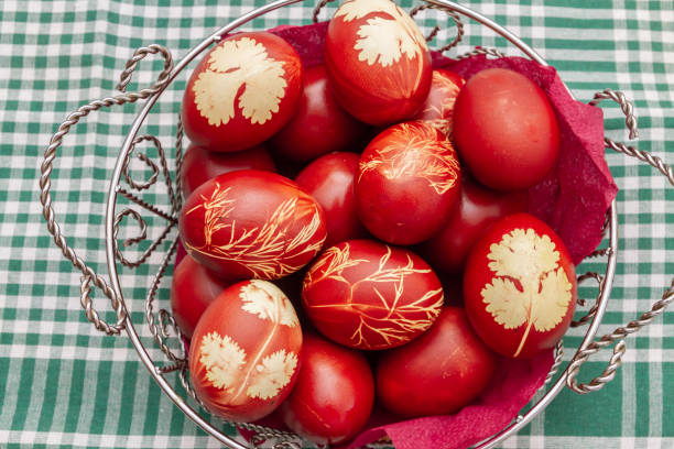 istock Painted Easter eggs in onion husks with abstract drawings are in a basket 1282998952