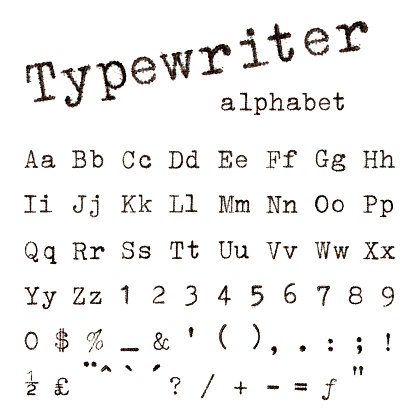 Typewriter alphabet. Macro photograph of typewriter letters isolated on white.