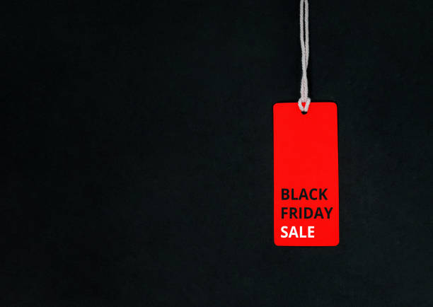 istock Black friday. Red Sale tag on the black background 1283001659