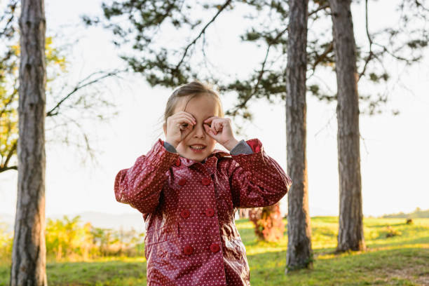 istock Child playing in autumn park 1283001875