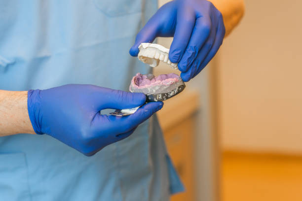 istock Dental Prosthetic in dentist's hands 1283002063