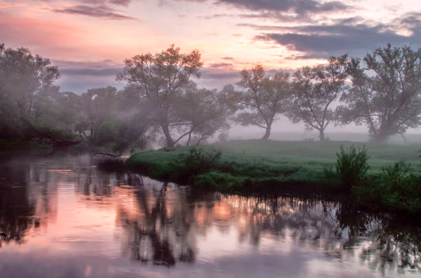 istock Beautiful sunset over the river with deep fog 1283002978