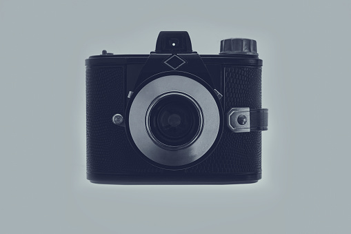 View of classic retro photo camera isolated on background