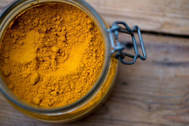istock Turmeric powder in clear preserving jar 1283004293