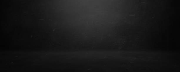 istock gray and black cement wall studio background, blank room and empty banner 1283004619