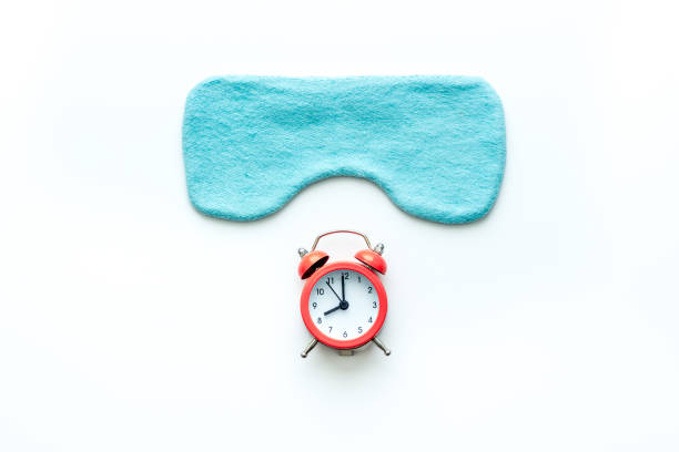 istock Sleeping mask with alarm clock, flat lat,top view 1283010719
