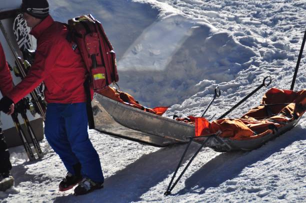 Rescue sleds outside the Rescue Base Ready for Emercency, in the alps near vienna Ski and Mountain Rescue Team checking Equipment on Base Station in Semmering in the alps near Vienna ski resort flash stock pictures, royalty-free photos & images