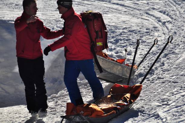 Rescue sleds outside the Rescue Base Ready for Emercency, in the alps near vienna Ski and Mountain Rescue Team checking Equipment on Base Station in Semmering in the alps near Vienna ski resort flash stock pictures, royalty-free photos & images