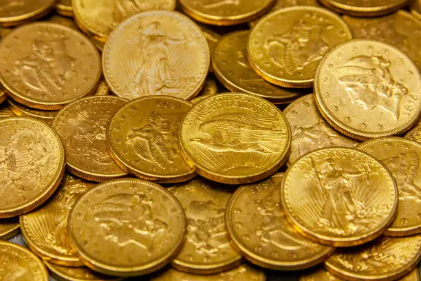 American gold coin treasure hoard of the rare USA double eagle 20 dollar bullion currency coinage used in the late 19th century as America money, stock photo image