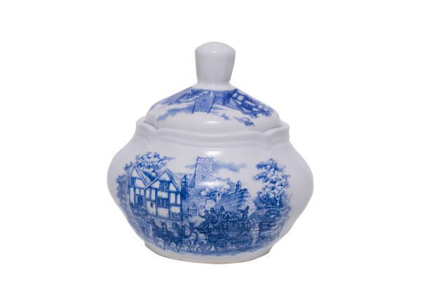 istock Old blue and white sugar bowl on a white background 1283012519