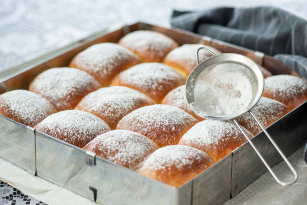 istock Sweet bread rolls with powdered sugar on top 1283012527