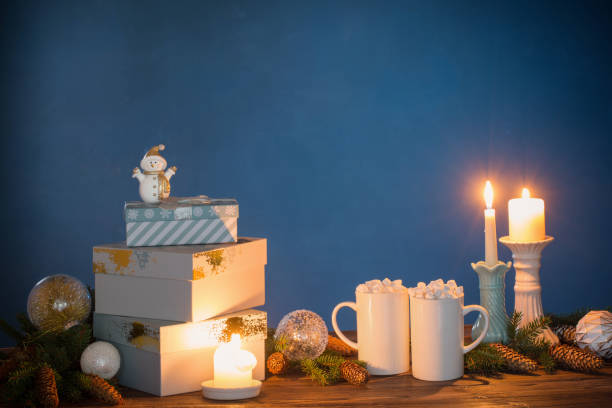 istock two white cups with drinks with marshmallows and christmas decorations on dark background 1283013446