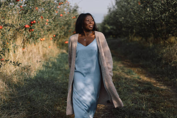 istock Afro woman in Apple Orchard. African ethnicity 1283013694