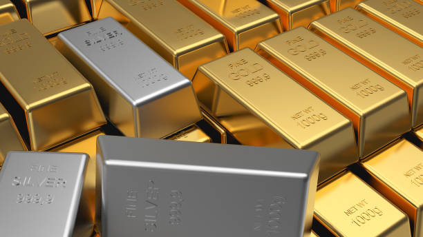 istock Rows of gold bars and scattered silver bars. 1283013853