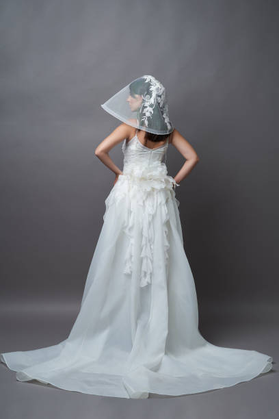 istock Beautiful young bride in wedding dress with veil 1283014700
