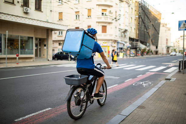 istock Rear view of a young Caucasian delivery man working 1283014923