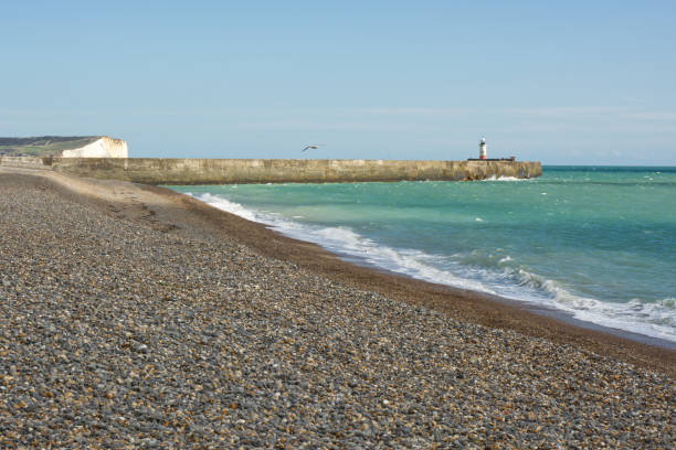 istock Newhaven beach and harbour, England 1283015053