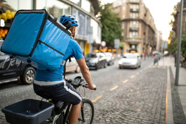 istock Rear view of a young Caucasian delivery man working 1283015188
