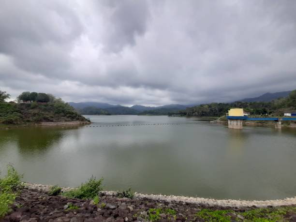 istock Water reservoir lake with reflections from cloudy sky 1283015334