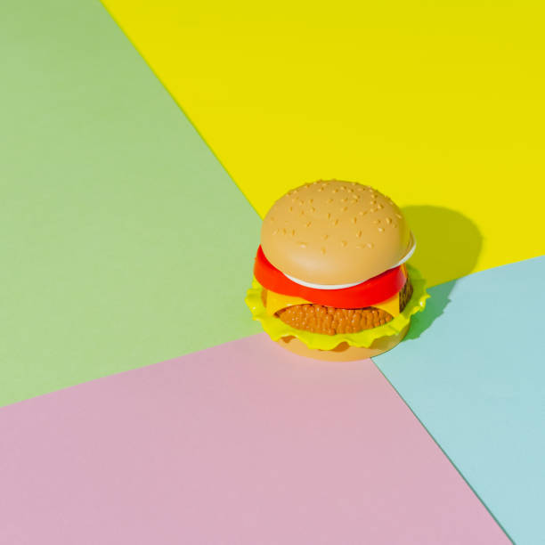 istock Appetizing burger with shadow on green, yellow and pink background. Creative concept. Plastic pop art isometric style. Minimalism 1283016116
